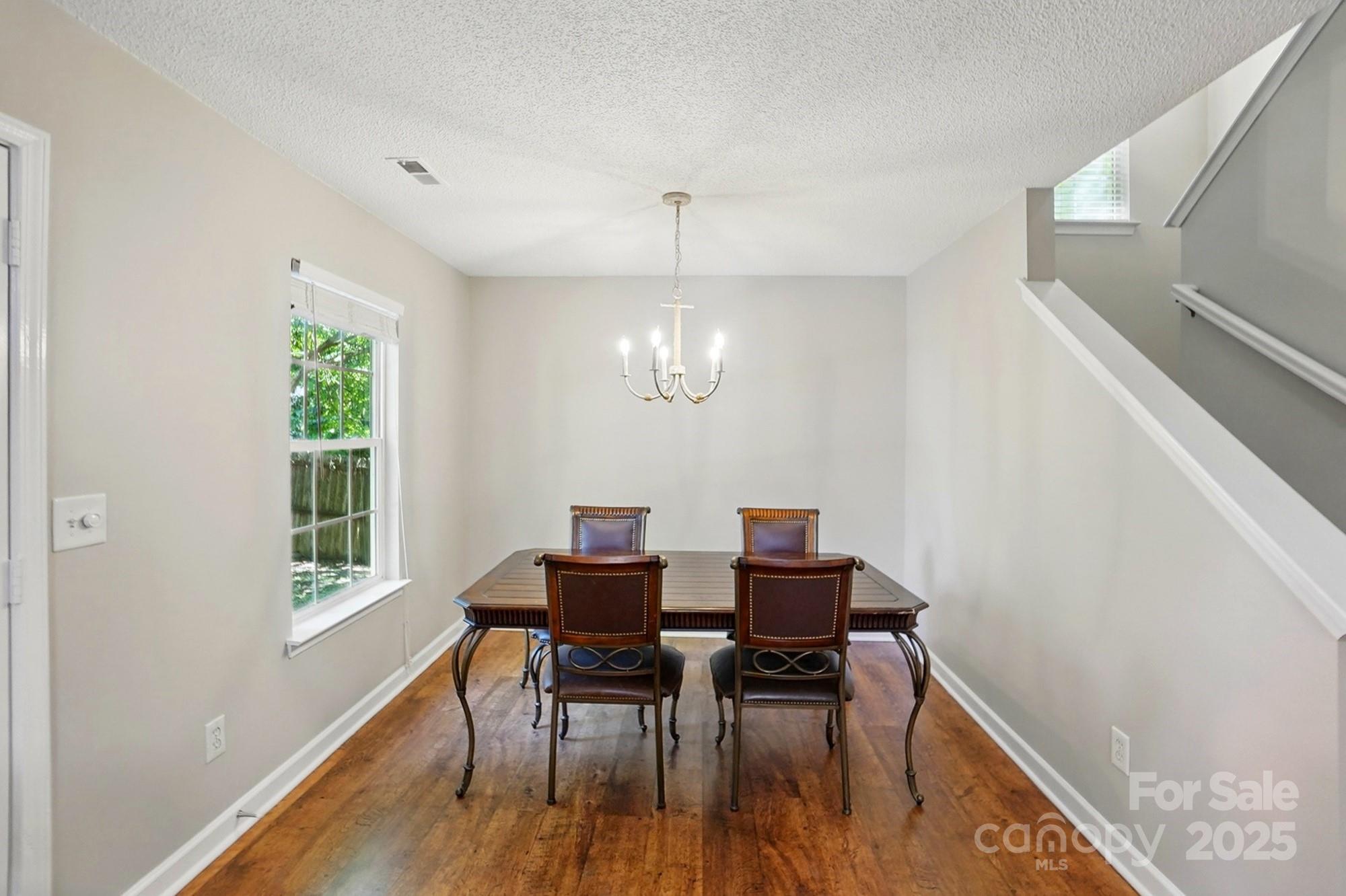 820 Settlement Street Clover, SC 29710 - Photo 9 of 29 a view of a dining room with furniture window and wooden floor