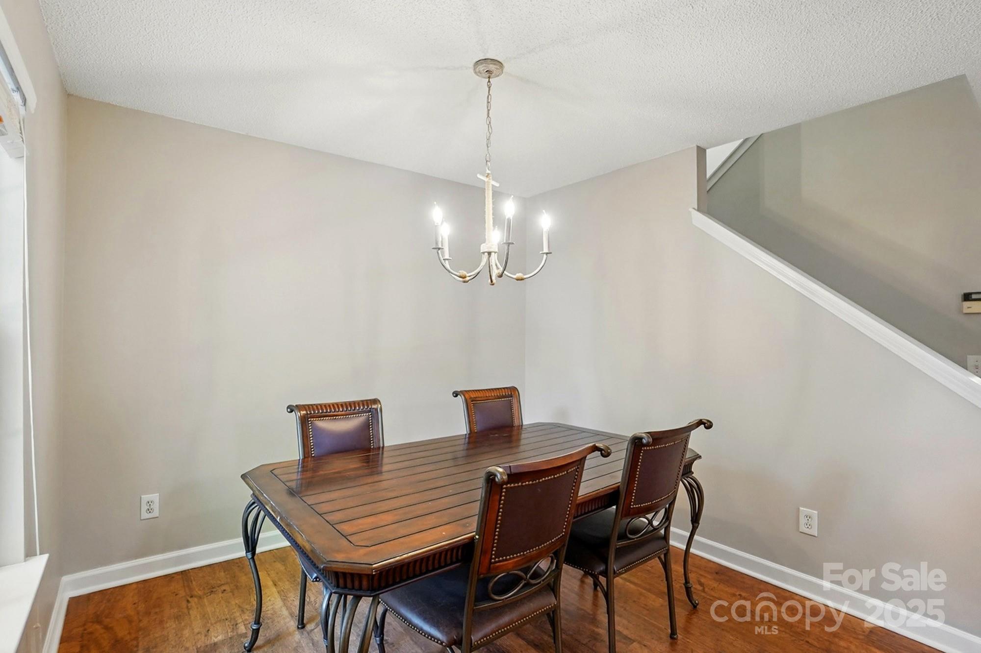 820 Settlement Street Clover, SC 29710 - Photo 10 of 29 a view of a dining room with furniture and wooden floor