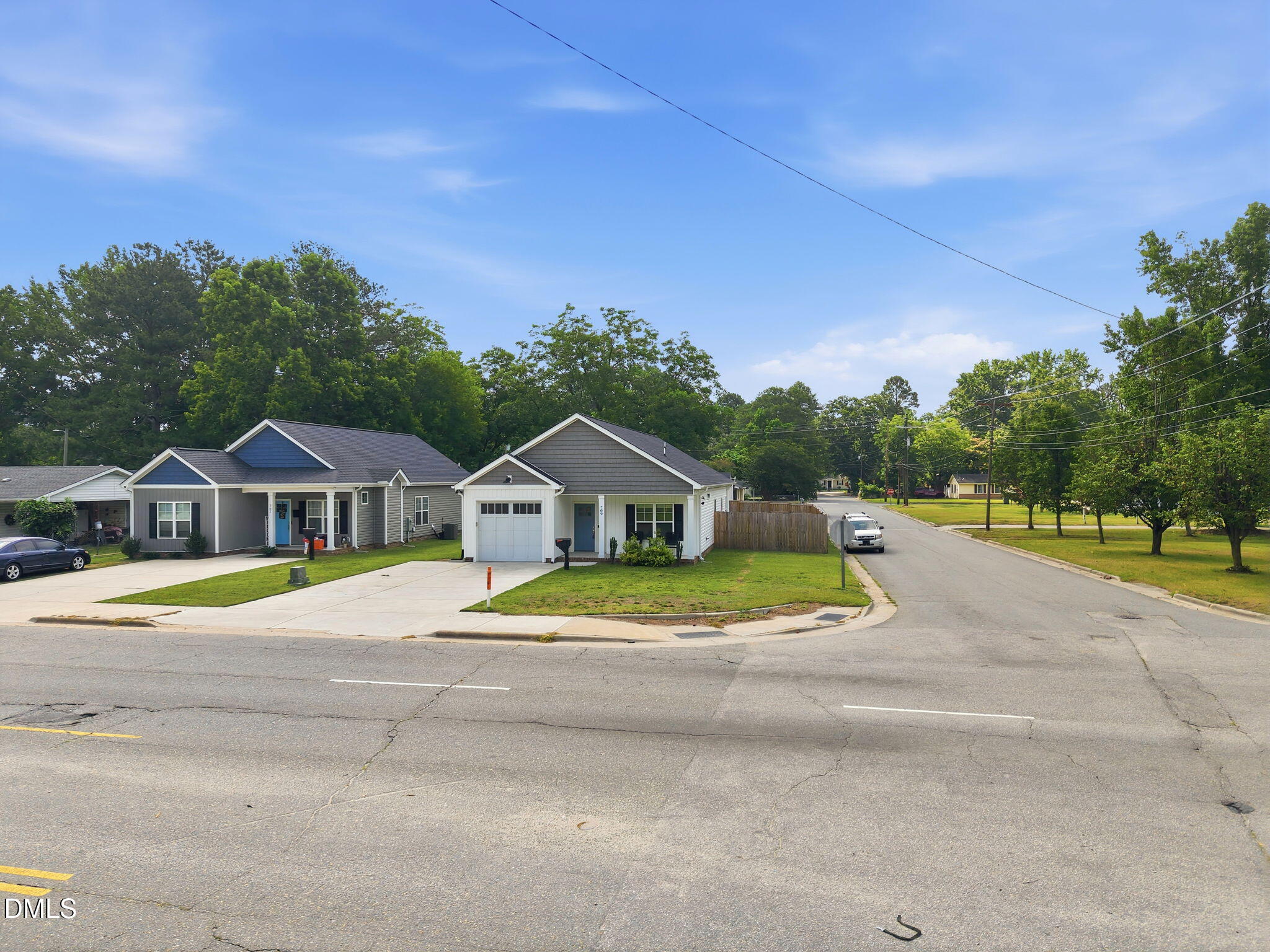 709 South Pollock Street Selma, NC 27576 - Photo 6 of 30 a view of house with yard and trees in the background