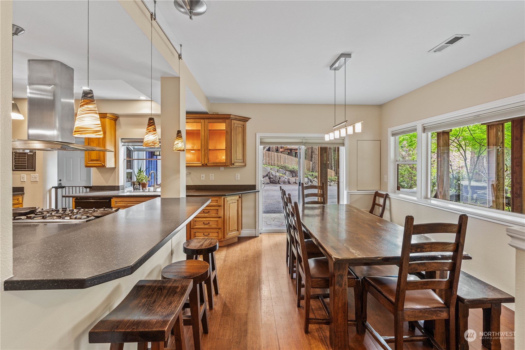 16508 Southeast 145th Street Renton, WA 98059 - Photo 6 of 37 a dining room with furniture a chandelier and window