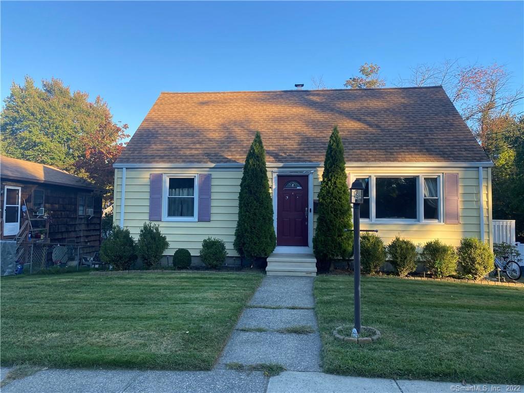 879 Milford Point Road Milford, CT 06460 - Photo 1 of 1 a front view of house with a garden
