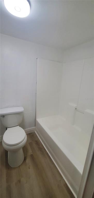 4305 Tony Street Orlando, FL 32808 - Photo 14 of 23 a bathroom with a toilet and a bathtub