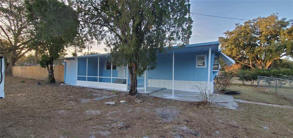 4305 Tony Street Orlando, FL 32808 - Photo 2 of 23 a house with trees in front of it
