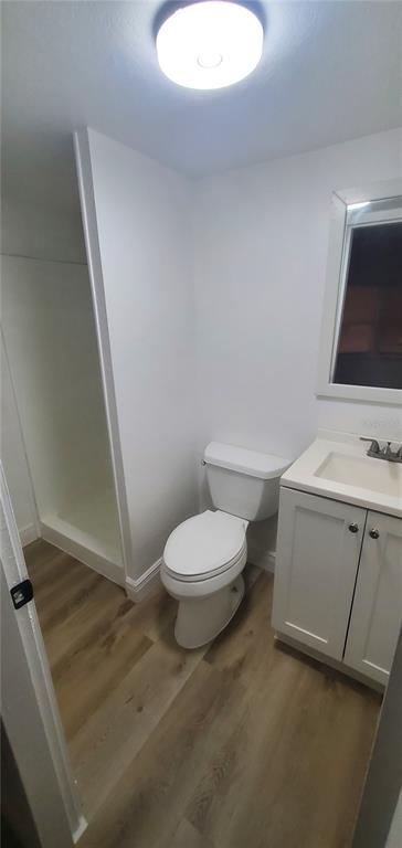 4305 Tony Street Orlando, FL 32808 - Photo 21 of 23 a bathroom with a toilet sink and mirror