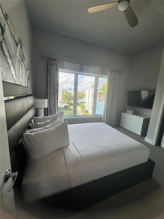 7770 Sandy Ridge Drive, Unit 210 Reunion, FL 34747 - Photo 19 of 42 a bedroom with a bed and window