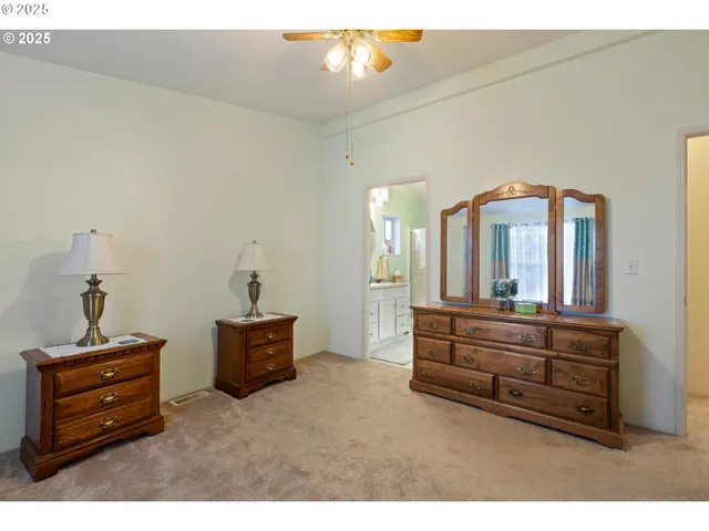 a living room with furniture and a mirror