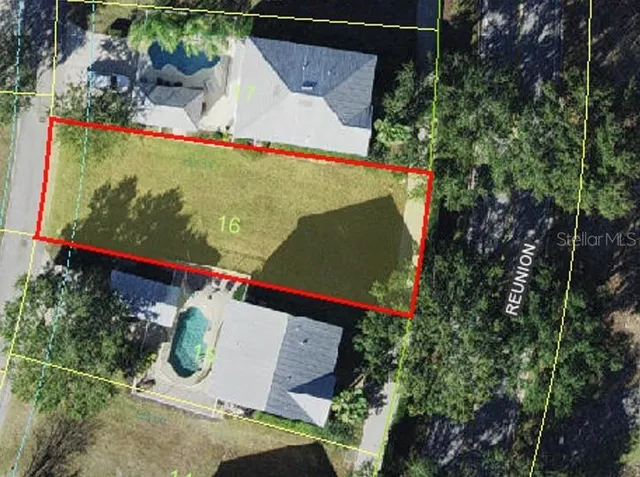 an aerial view of a house with yard