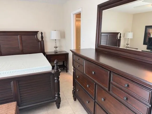a kitchen with a sink and a mirror