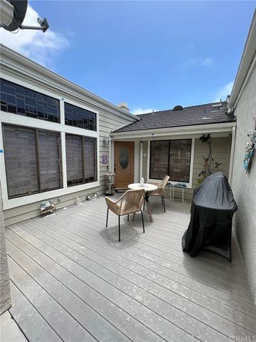 a view of a roof deck with table and chairs