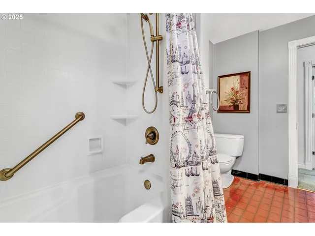 a picture of a bathroom with a shower