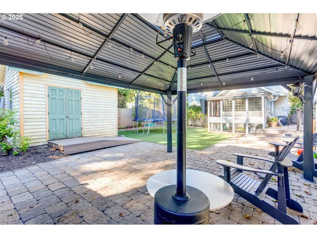 a patio with a table and chairs