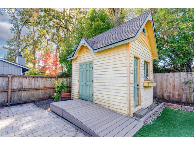 a view of house with backyard and wooden floor