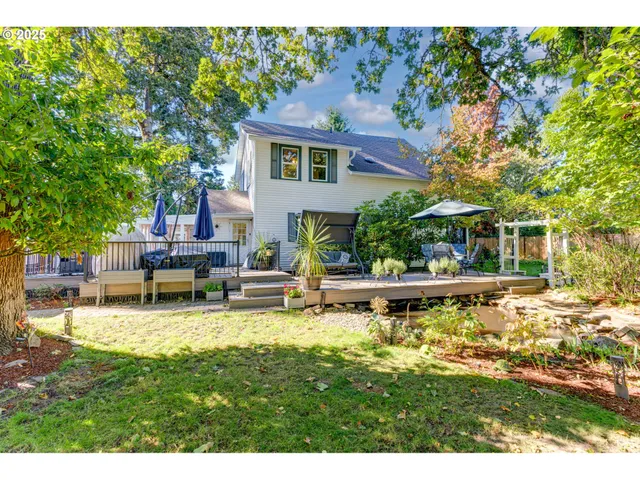 a swimming pool with outdoor seating and yard