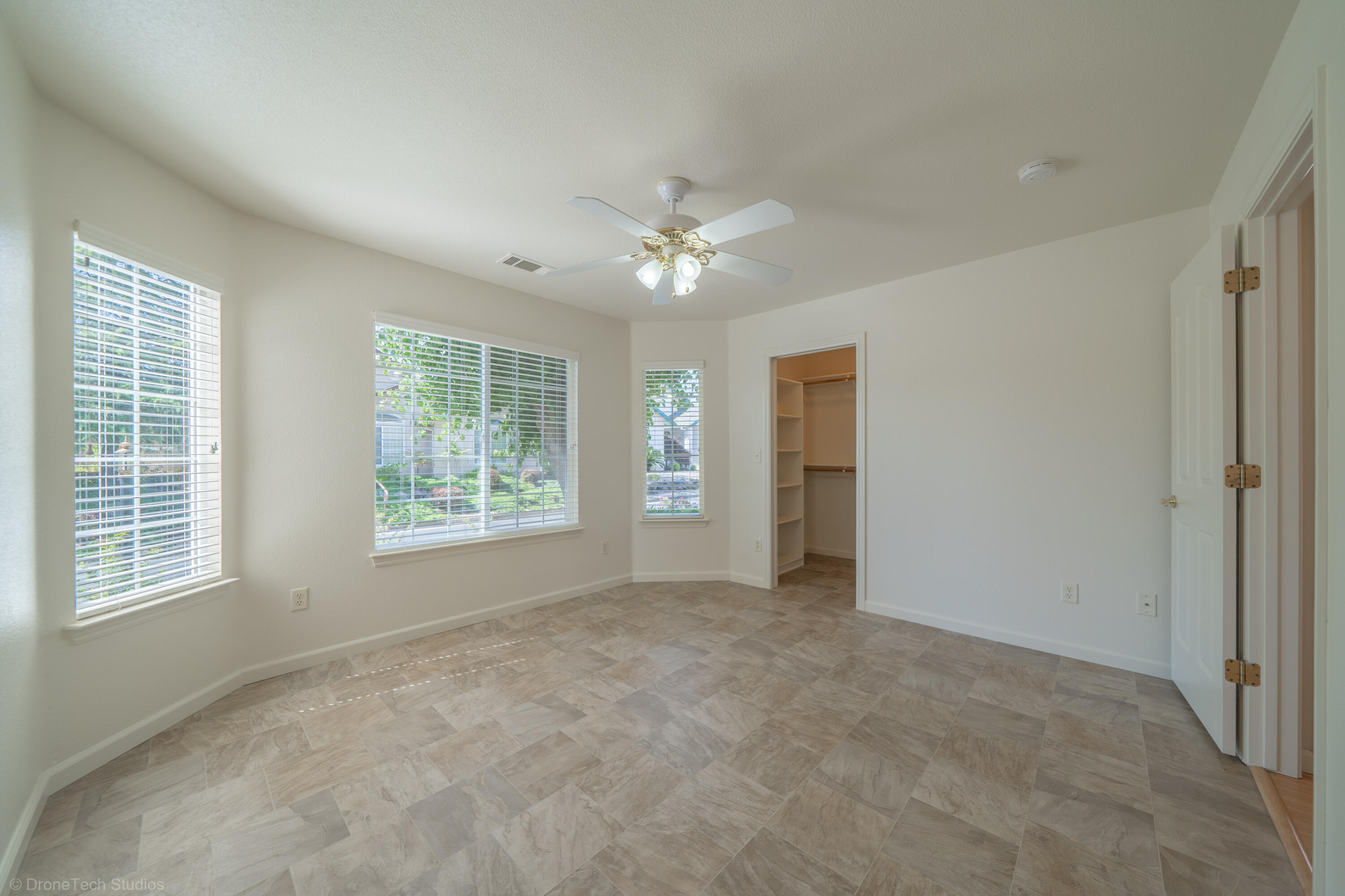 1764 Capistrano Walk Redding, CA 96003 - Photo 13 of 34 a view of an empty room with a window