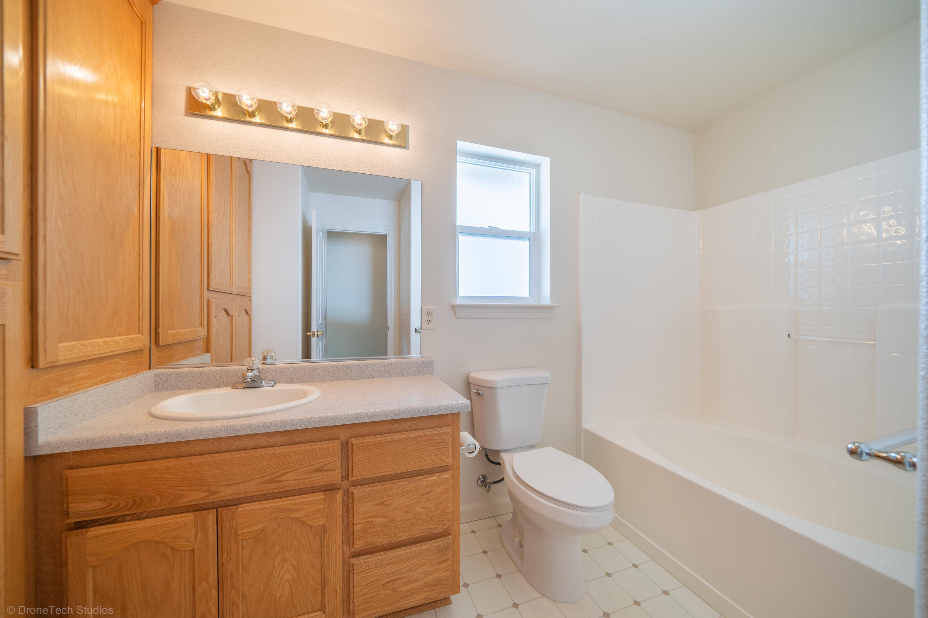 1764 Capistrano Walk Redding, CA 96003 - Photo 16 of 34 a bathroom with a sink a toilet and mirror