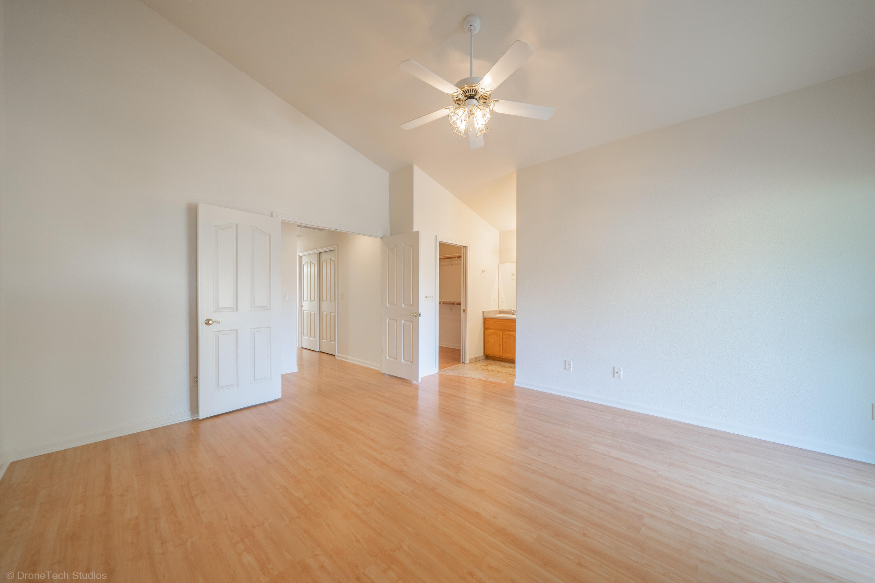 1764 Capistrano Walk Redding, CA 96003 - Photo 19 of 34 a view of an empty room with wooden floor