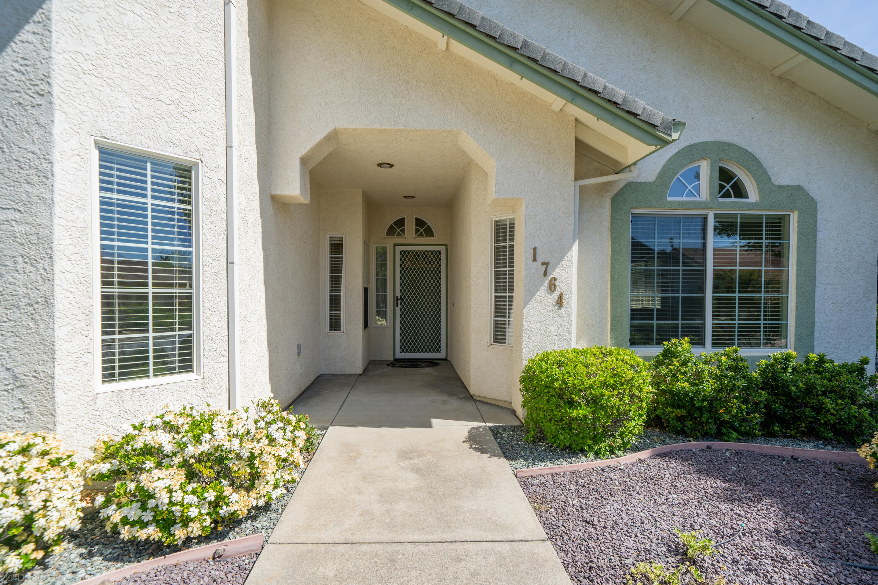 1764 Capistrano Walk Redding, CA 96003 - Photo 2 of 34 a view of a house with potted plants