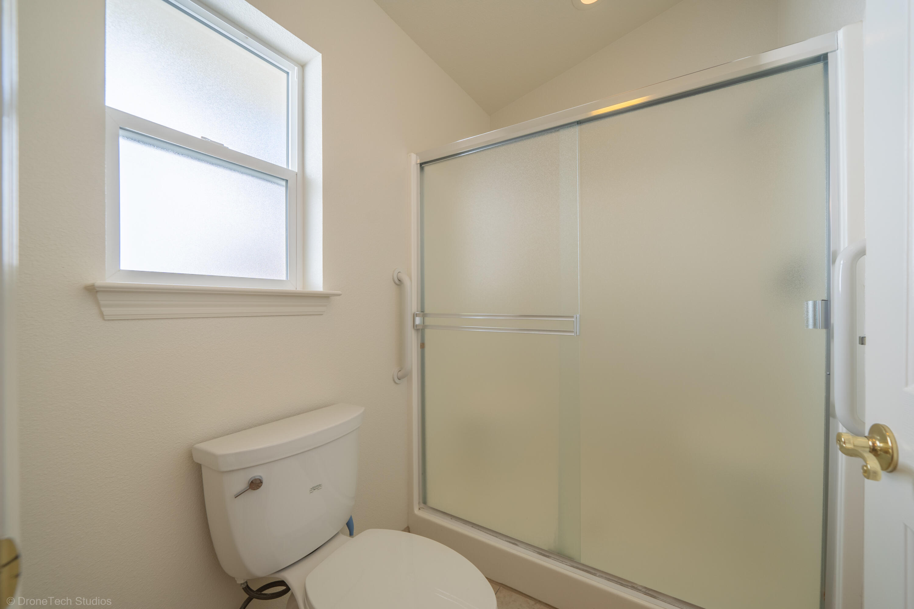 1764 Capistrano Walk Redding, CA 96003 - Photo 22 of 34 a white toilet sitting next to a bathroom sink