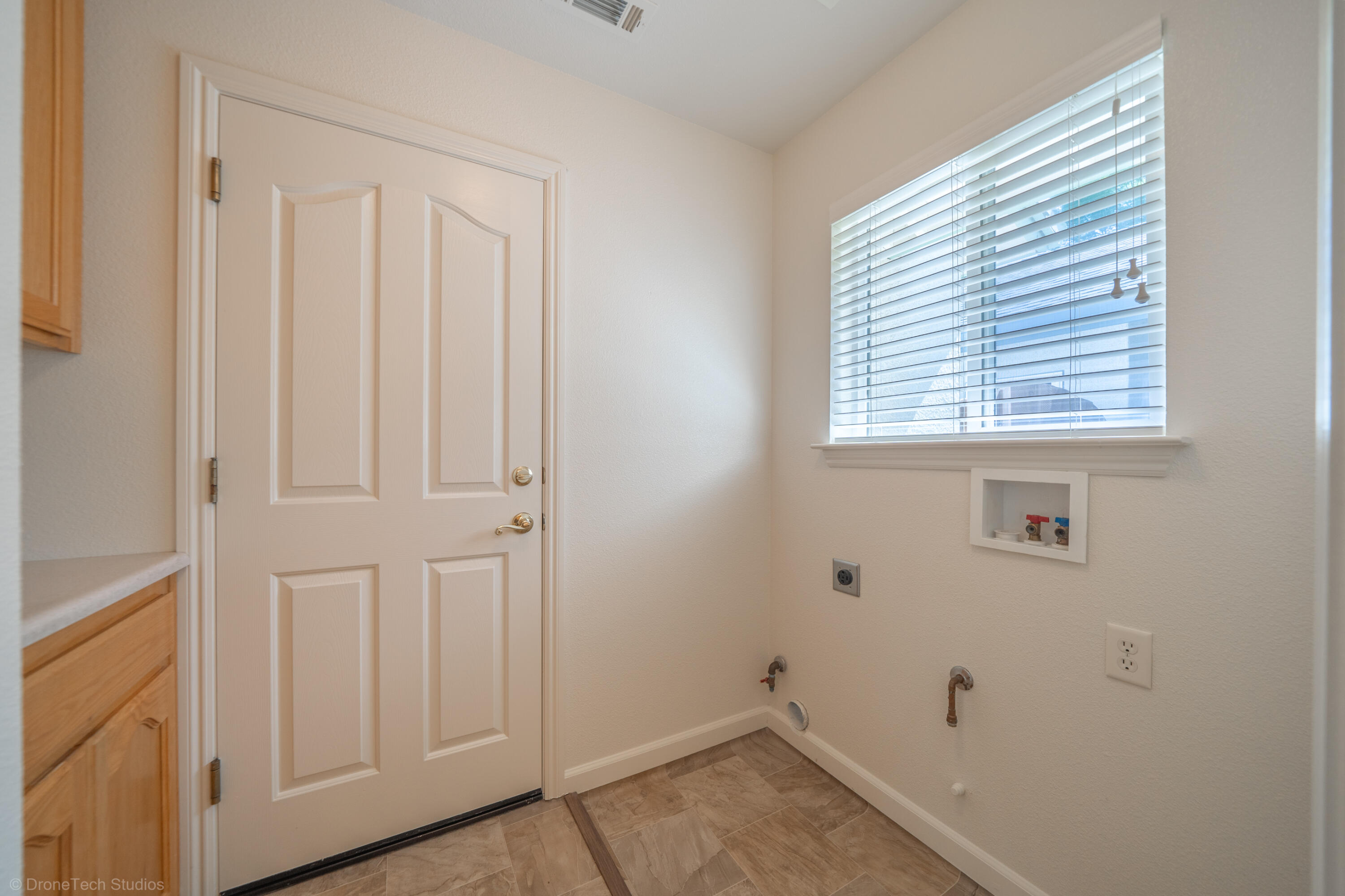 1764 Capistrano Walk Redding, CA 96003 - Photo 24 of 34 a view of a room that has a window in it