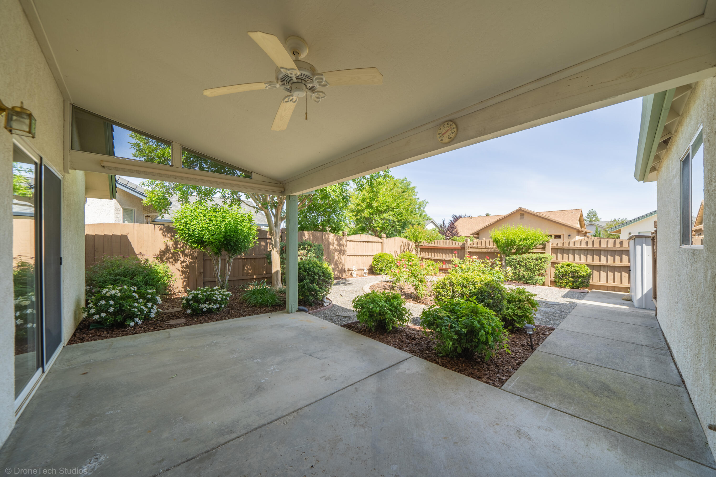 1764 Capistrano Walk Redding, CA 96003 - Photo 26 of 34 a view of a garden from a porch