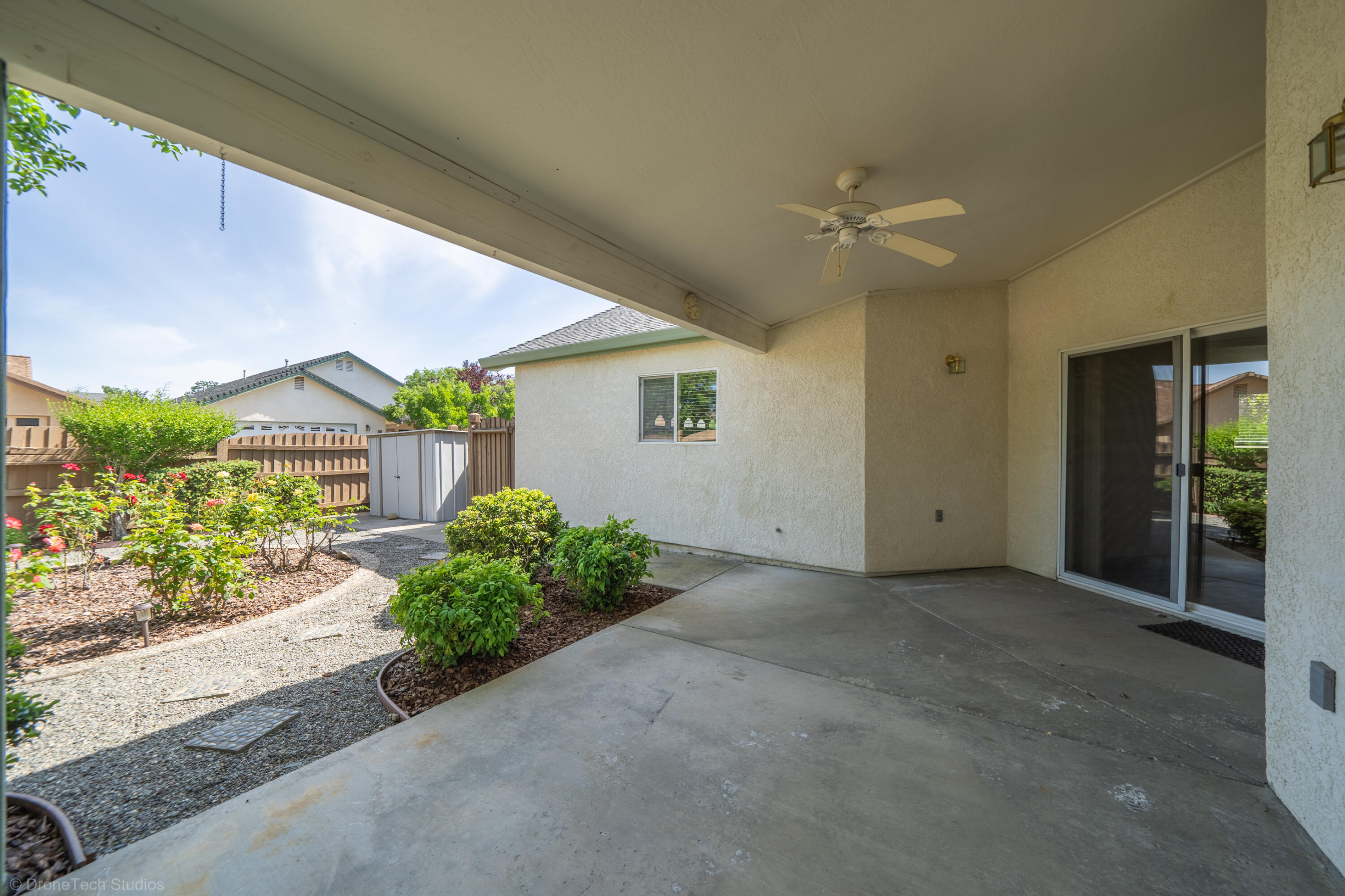 1764 Capistrano Walk Redding, CA 96003 - Photo 27 of 34 a view of a house with a yard and potted plants