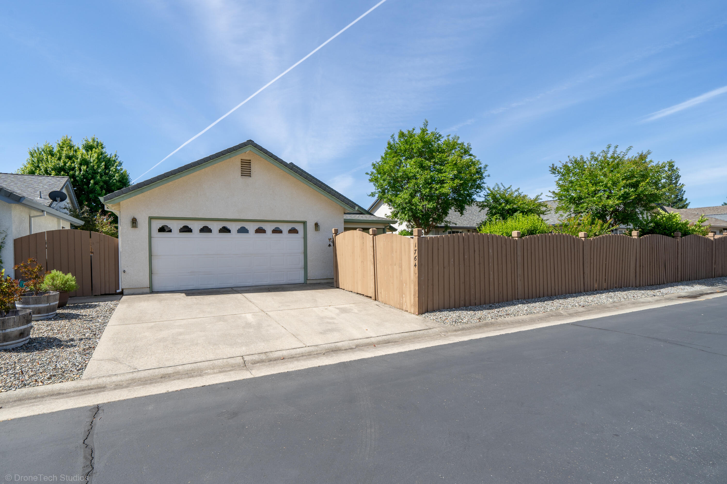 1764 Capistrano Walk Redding, CA 96003 - Photo 32 of 34 a front view of a house with a garage