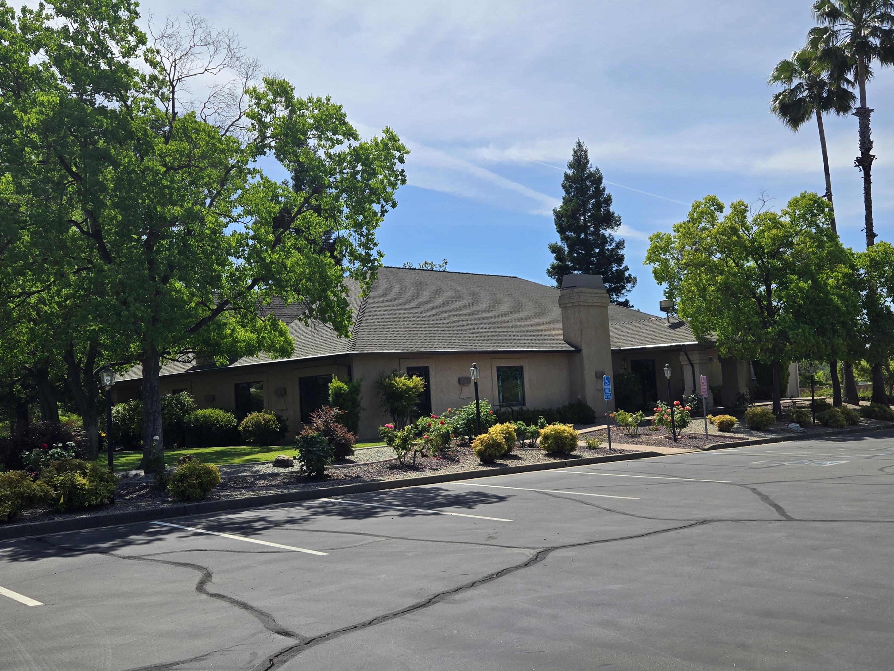 1764 Capistrano Walk Redding, CA 96003 - Photo 33 of 34 a front view of a building with tree s
