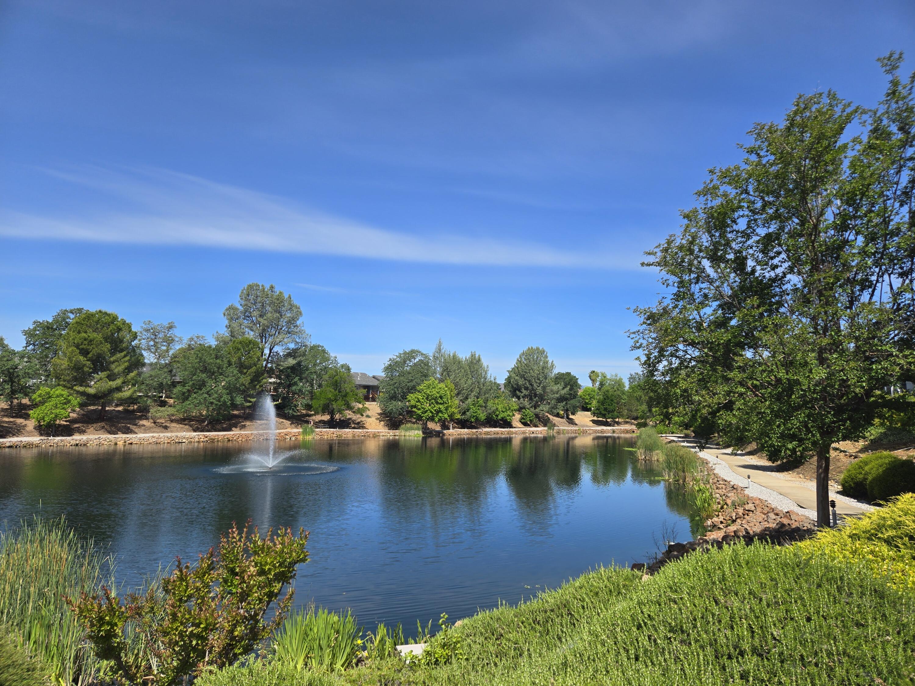 1764 Capistrano Walk Redding, CA 96003 - Photo 34 of 34 a view of a lake with houses in the background