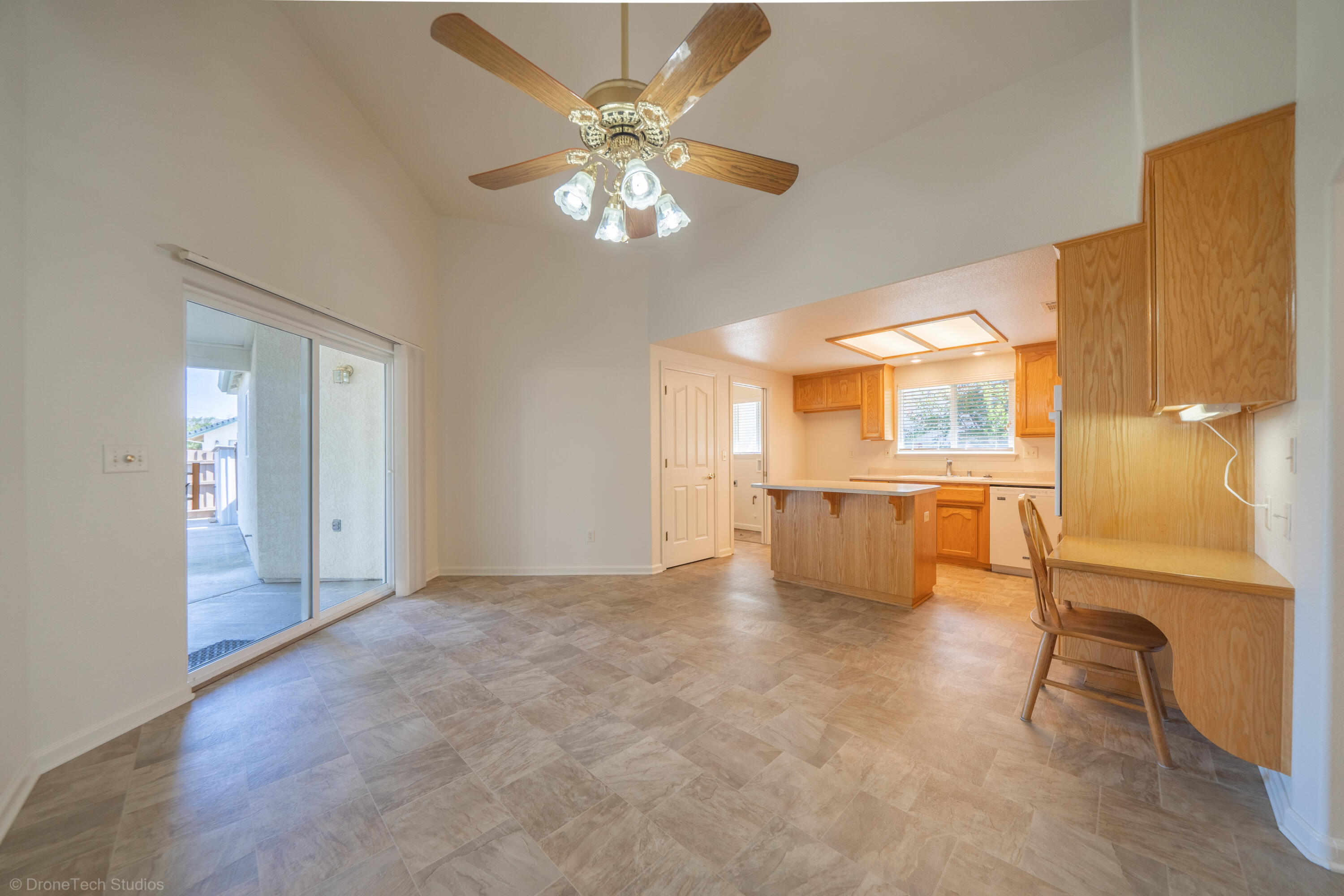 1764 Capistrano Walk Redding, CA 96003 - Photo 9 of 34 a view of an empty room with a kitchen