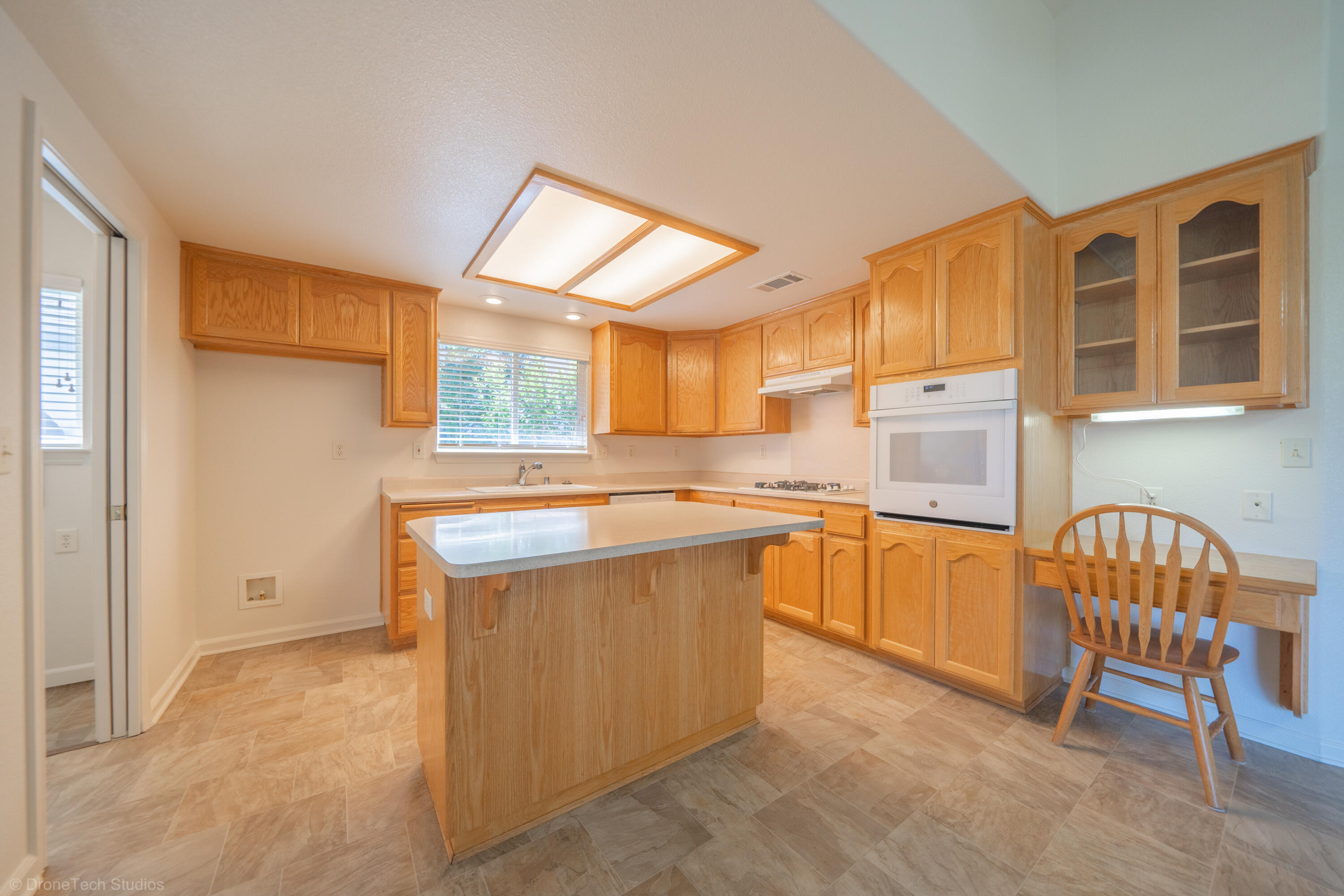 1764 Capistrano Walk Redding, CA 96003 - Photo 10 of 34 a kitchen that has a sink and chairs