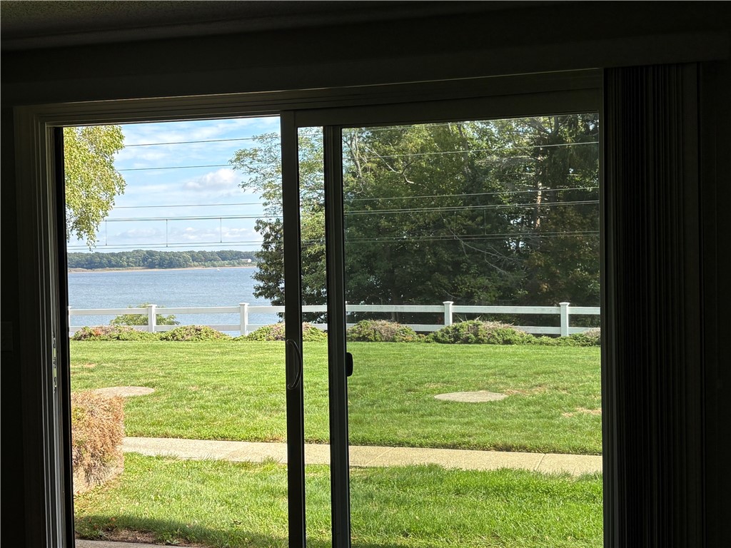 4162 Post Road, Unit 3 Warwick, RI 02818 - Photo 2 of 20 First floor view out to patio area. View of the bay!