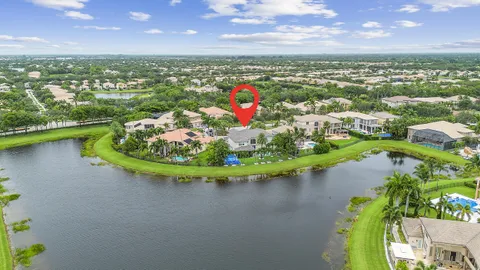 an aerial view of lake residential houses with outdoor space and swimming pool