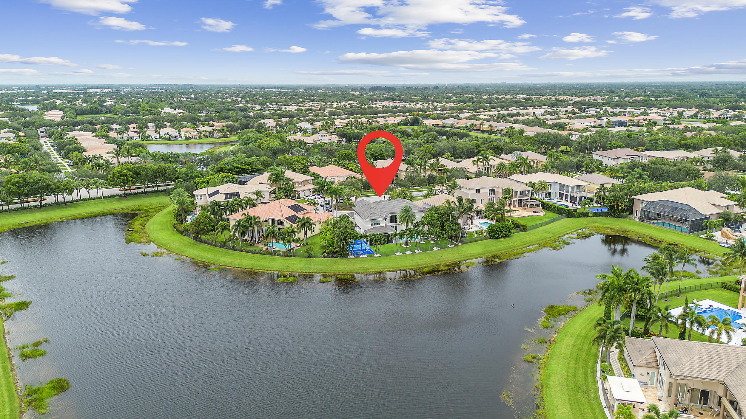 8680 Daystar Ridge Point Boynton Beach, FL 33473 - Photo 19 of 25 an aerial view of lake residential houses with outdoor space and swimming pool