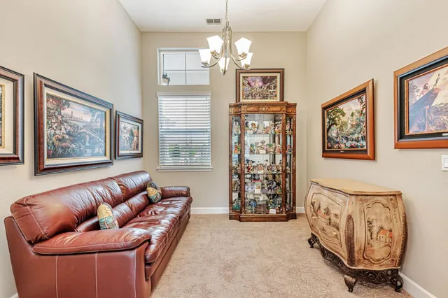 a kitchen with kitchen island a appliances dining table and chairs