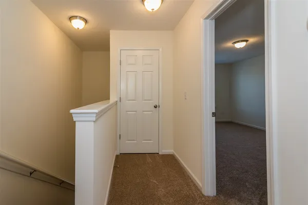 a view of a hallway with closet