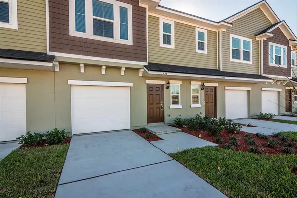 a front view of a house having yard