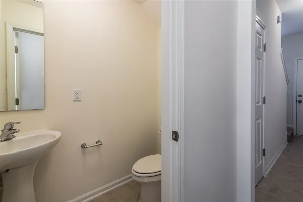 a bathroom with a sink toilet and vanity