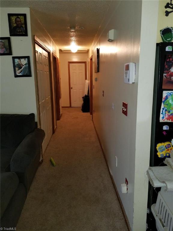 226 Roy Lopp Road Lexington, NC 27292 - Photo 8 of 18 Comfortably Wide Hallway with Laundry Area