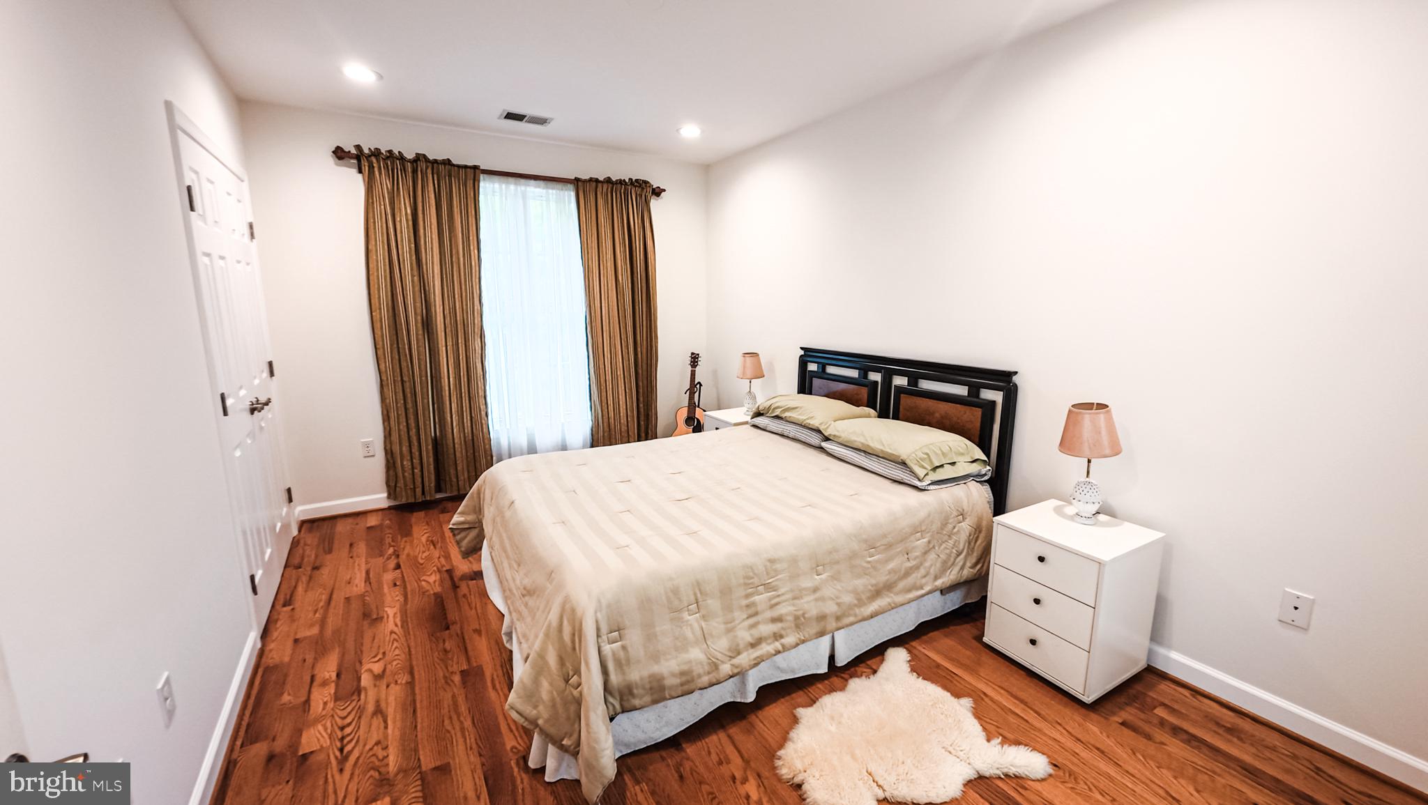 1807 Anderson Road Falls Church, VA 22043 - Photo 23 of 33 Serene bedroom with warm wood tones.