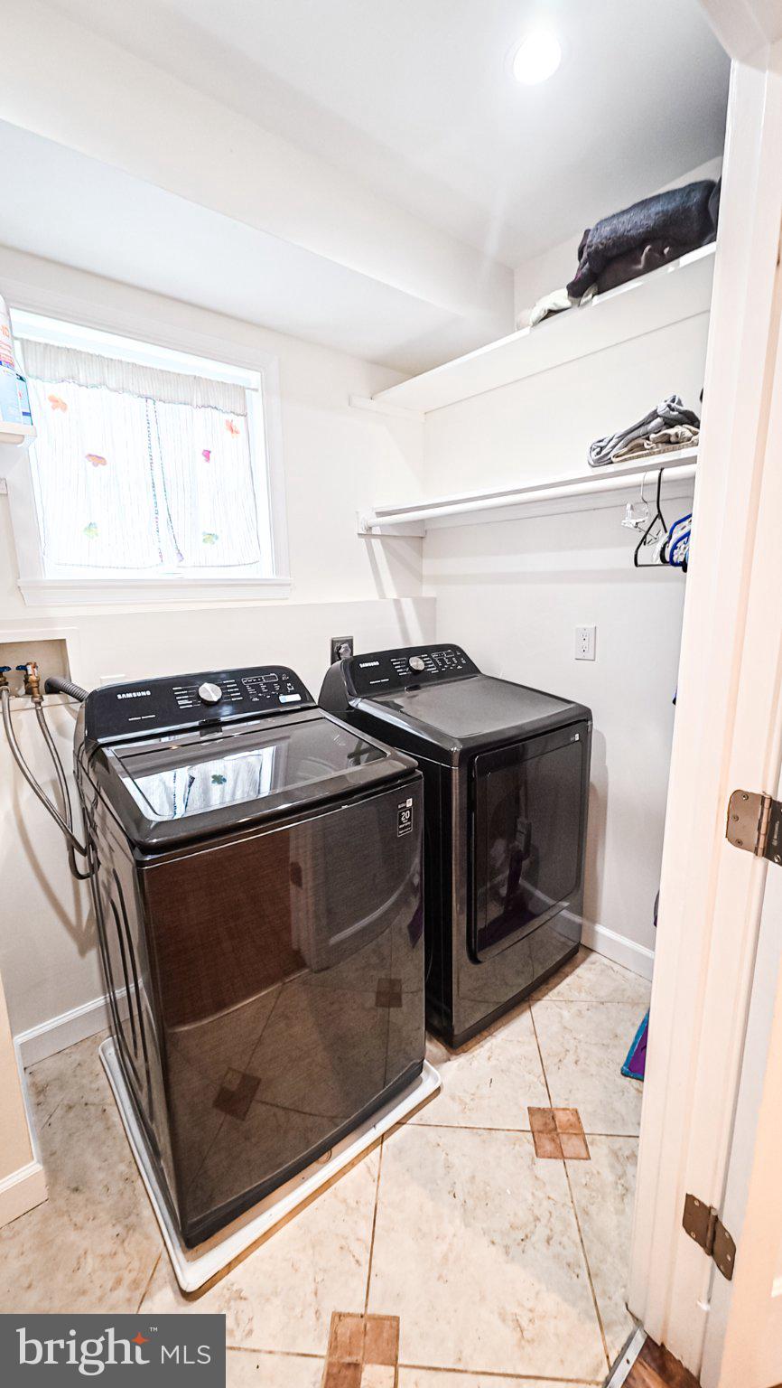 1807 Anderson Road Falls Church, VA 22043 - Photo 26 of 33 Modern laundry space with sleek appliances.