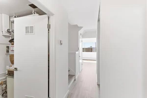 a bathroom with a shower and a glass door