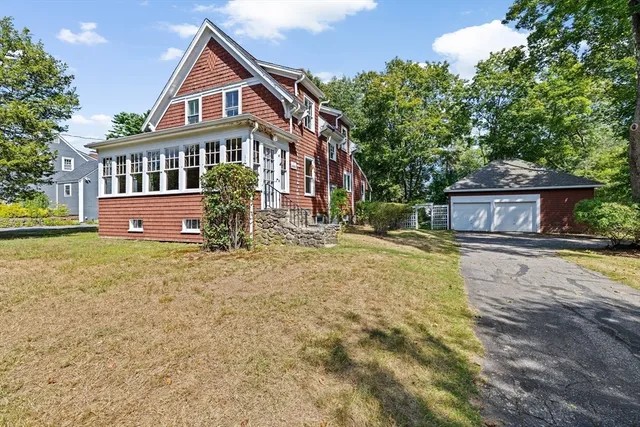 a front view of a house with a yard