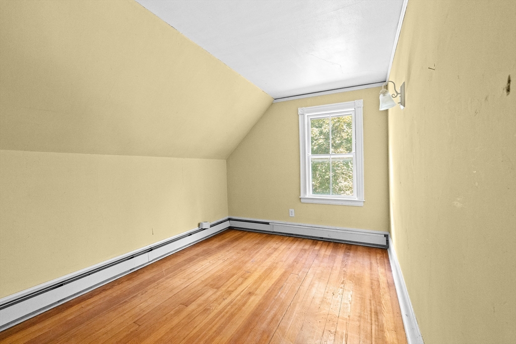 62 High Street Norwell, MA 02061 - Photo 18 of 37 an empty room with wooden floor and windows