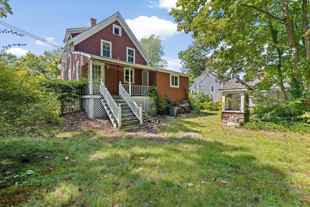 62 High Street Norwell, MA 02061 - Photo 28 of 37 a front view of a house with a yard and porch