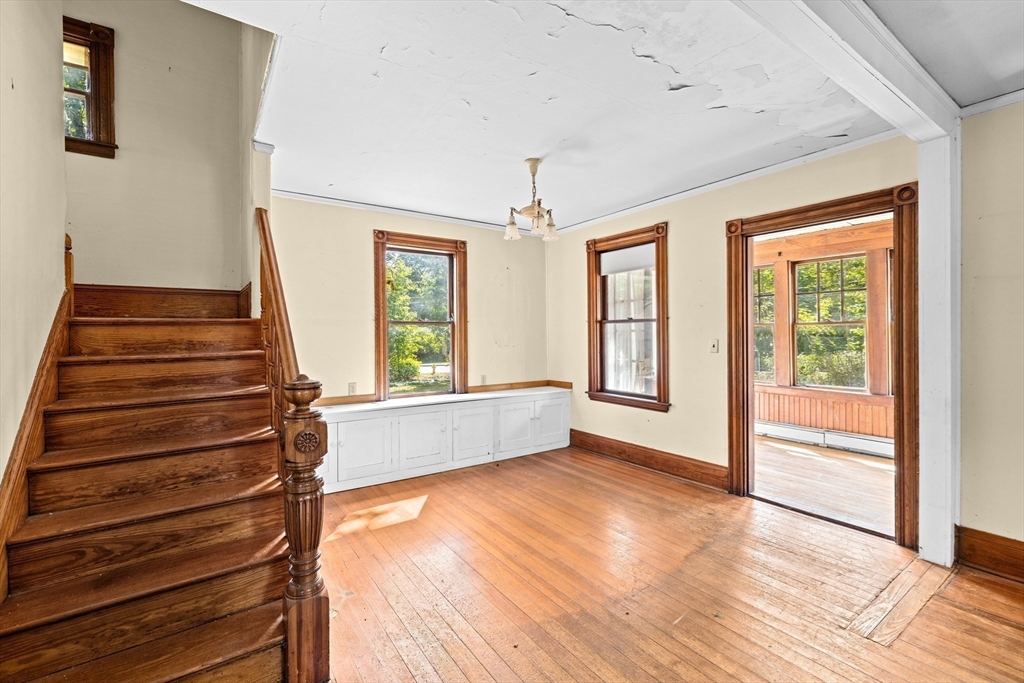 62 High Street Norwell, MA 02061 - Photo 6 of 37 a view of an empty room with wooden floor and a window