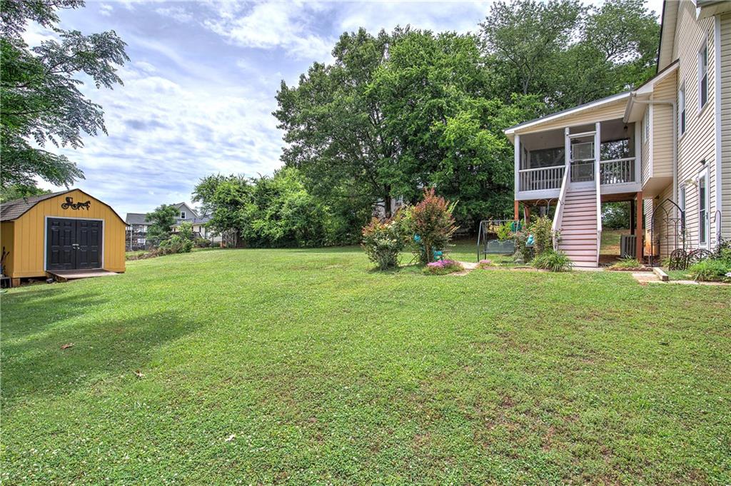 218 Gilreath Road Southeast Cartersville, GA 30121 - Photo 24 of 27 a backyard of a house with seating space