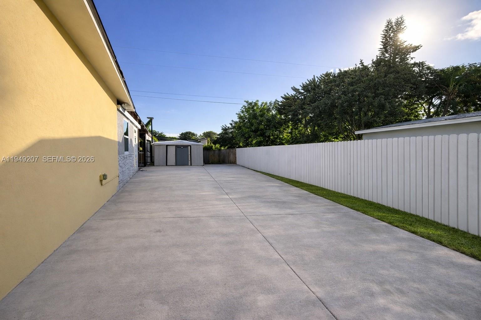 11930 Southwest 187th Terrace Miami, FL 33177 - Photo 11 of 13 a view of a patio with a yard