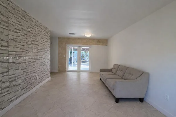 a view of livingroom with furniture and window