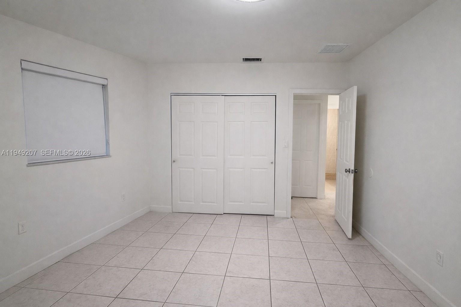 11930 Southwest 187th Terrace Miami, FL 33177 - Photo 5 of 13 a view of an empty room