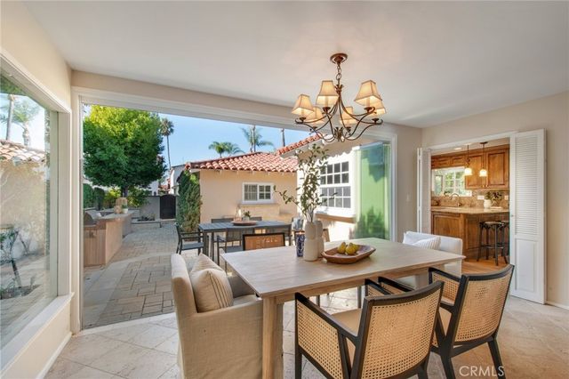 a living room with furniture fireplace and a large window